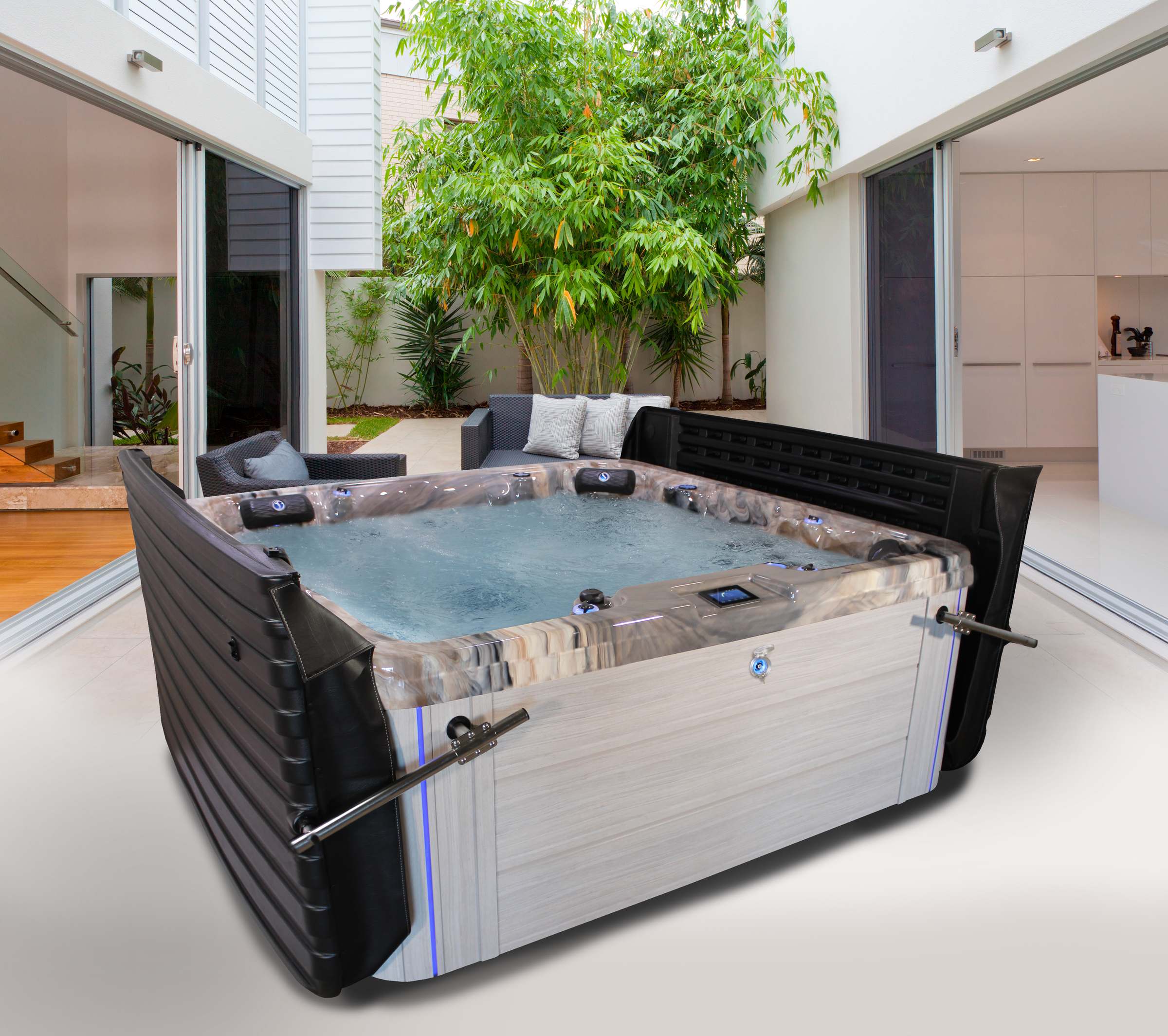 Iconic Series spa with the fully automated DURA-SHIELD HardCover raised at the touch of a key, White Sands cabinet and Tuscan Sun shell