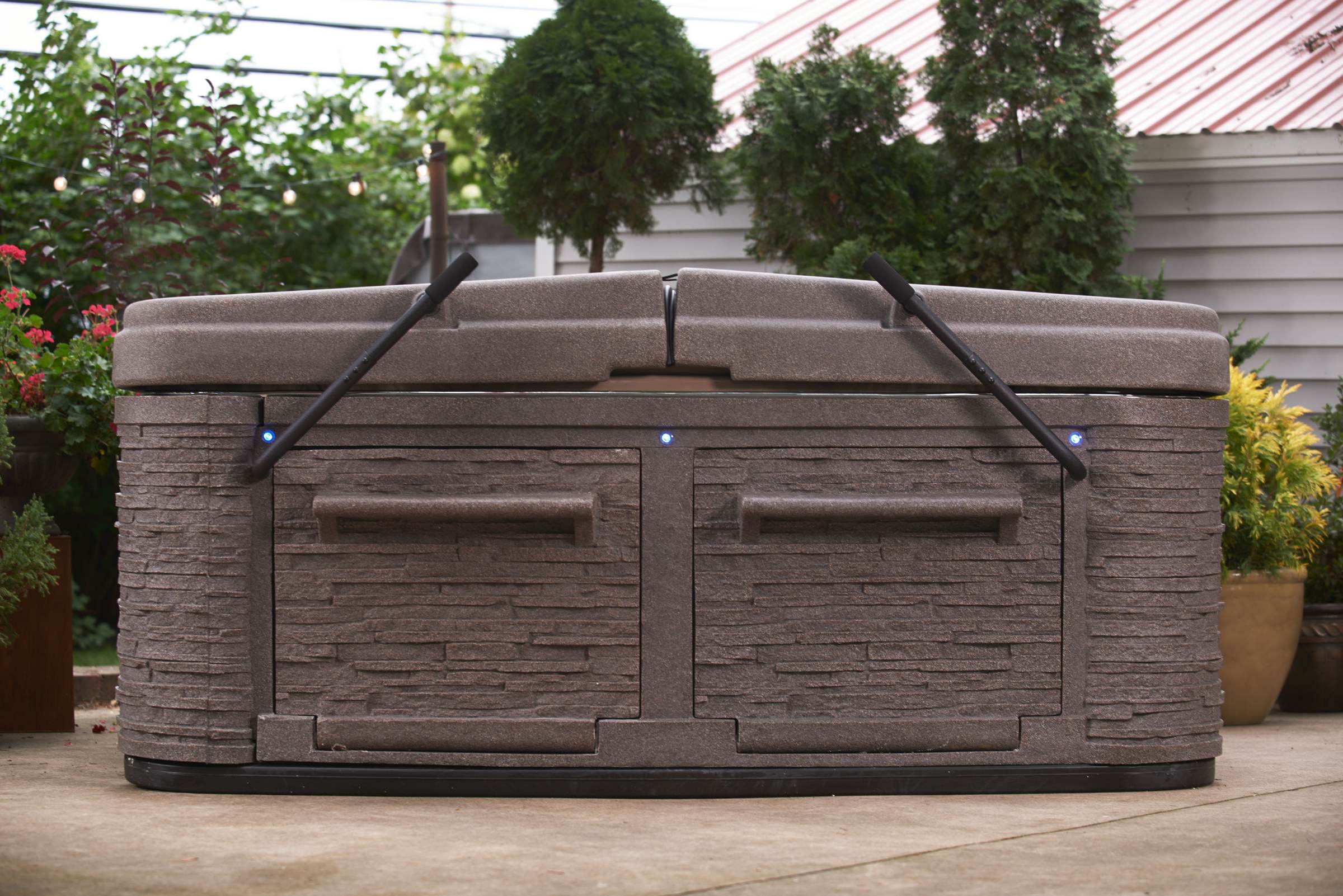 Premium Collection spa with the DURA-SHIELD HardCover closed and latched down on a Millstone cabinet